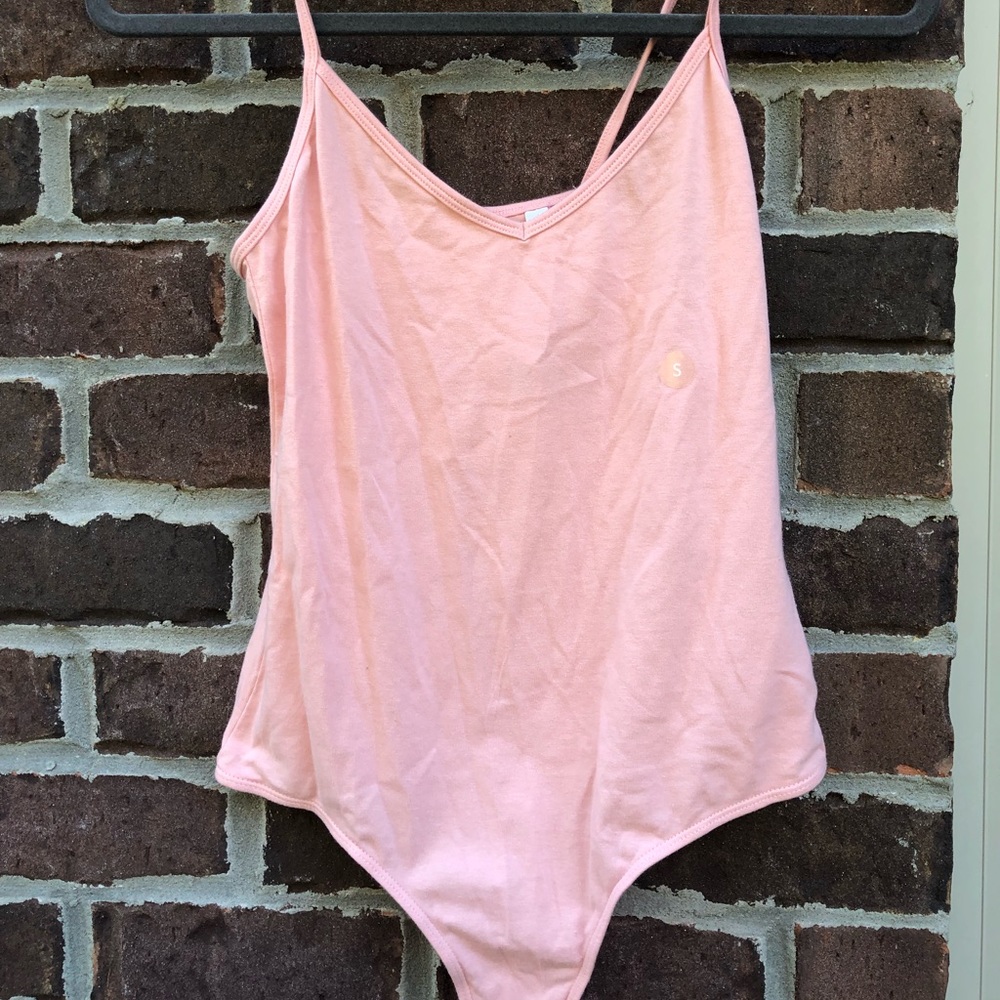 pink body suit